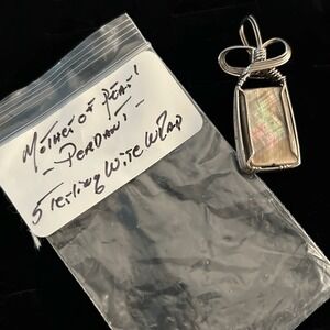 Handcrafted Mother of Pearl Pendant Wrapped in Sterling Silver Wire.